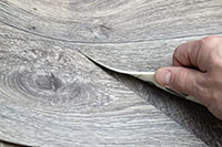 Roll of linoleum with a wood texture. Linoleum cutting. Floor coverings. lino flooring
